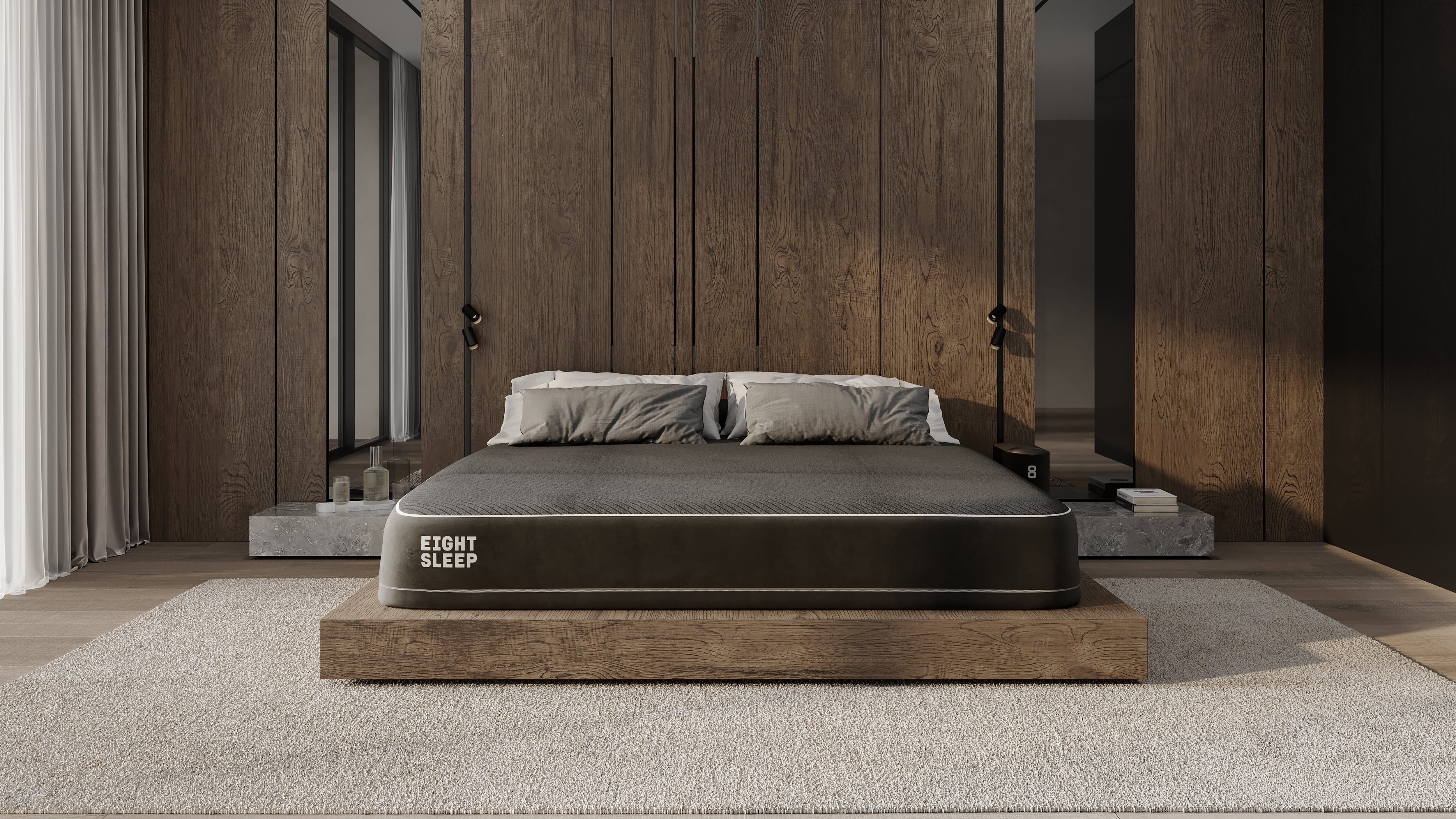 The Eight Sleep Pod mattress in a tastefully furnished room Comfortable pillows are in abundance awaiting anyone who wishes to experience the ultimate slumber experience